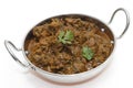 Methi lamb in a kadai bowl Royalty Free Stock Photo