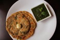 Methi paratha topped with ghee