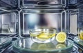 A method of cleaning in a microwave oven with water and lemon Royalty Free Stock Photo