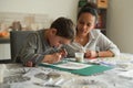 Metis mother doing painting with her son Royalty Free Stock Photo