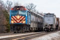 Metra commuter train passes freight train east of Joliet