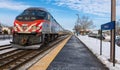 Metra 410 eastbound commuter train crosses over to another track to allow Metra 418 westbound to proceed Royalty Free Stock Photo