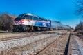 Metra locomotive pulls commuter train