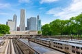 Metra and South Shore Trains at Van Buren Street Station with a City Skyline