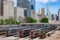 Metra and South Shore Trains at Van Buren Street Station with a City Skyline