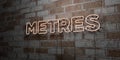 METRES - Glowing Neon Sign on stonework wall - 3D rendered royalty free stock illustration