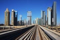 Metro on the background of skyscrapers of Dubai World Trade cent Royalty Free Stock Photo