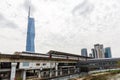 Metro LRT train of Kelana Jaya Line at Pasar Seni station and skyscraper Merdeka PNB 118 Tower in Kuala Lumpur, Malaysia Royalty Free Stock Photo