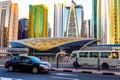 Metro railway among among glass skyscrapers in Dubai. Traffic on street in Dubai. Cityscape skyline. Urban background.