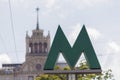 Metro sign on the background of the building of the Soviet era. Kiev