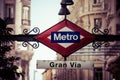 Metro Sign on blurred city, Madrid Royalty Free Stock Photo