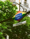 Metro sign of Chueca metro station in gay friendly district downtown Madrid at summertime Royalty Free Stock Photo