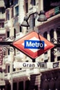 Metro Sign Gran Via on blurred city, Madrid Royalty Free Stock Photo