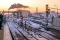 Metro station on the background of urban landscape in winter with snow and rails with traffic lights Royalty Free Stock Photo