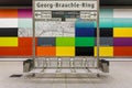 Metro station seats with a colorful wall in the background in Georg-Brauchle-Ring station, Germany