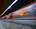 metro train in fast movement at station