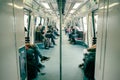 Metro train interior with unidentified passengers in Singapore subway system Royalty Free Stock Photo