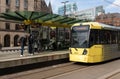 Metrolink Tram at St Peters Square Station.  Public Transport Vehicle.  Passengers in shot Royalty Free Stock Photo