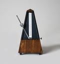 Metronome in action, closeup, and on a plain background Royalty Free Stock Photo