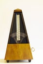 Wooden Mechanical Metronome with blurred arm moving Royalty Free Stock Photo