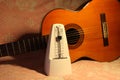 Metronome with classical guitar Royalty Free Stock Photo