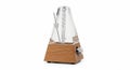 Metronome with a pyramid shape, featuring a transparent plastic casing and a Royalty Free Stock Photo