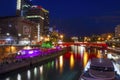 Metropolitan cityscape night life in vienna riverside with colourful lights and buildings in summer