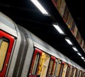 Train on the platform at Euston Square Underground Station, London UK, showing reflection of train on ceiling above. Royalty Free Stock Photo