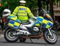 Police motorcycle officer on stand-by at road block outside Parliament Square, London,UK.