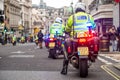 Metropolitan Police motorcycle riders escort a protest demonstration in central London, England. Royalty Free Stock Photo