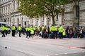Metropolitan Police Officers gather ready to move Extinction Rebellion Protesters from sitting on the road in Whitehall