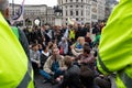 Metropolitan police officers monitoring Extinction Rebellion protesters at Trafalgar Square London UK. signtalkin