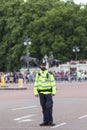 Metropolitan policeman and tourist waiting for ceremonial changing of the London guards, London, United Kingdom