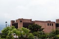 Metropolitan Theater of Medellin seen from river parks with plancases in the foreground