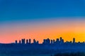 Metrotown district on late sunset sky background