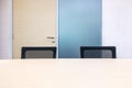 The metting room have wood desk and black chairs. Office interview room. Royalty Free Stock Photo