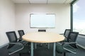 The metting room have wood desk and black chairs. Office meetting room. Royalty Free Stock Photo