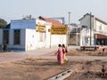 Indian women walking near a train station