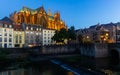 Metz cityscape at nigh with illuminated Cathedral on bank of Moselle River