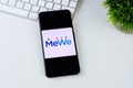 MeWe app logo on a smartphone screen.