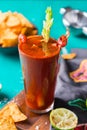 Mexican alcohol cocktail Clamato beer with shrimps and celery stick Royalty Free Stock Photo