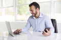 Mexican attractive businessman on his 30s working at modern home office with computer laptop Royalty Free Stock Photo