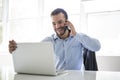 Mexican attractive businessman on his 30s working at modern home office with computer laptop Royalty Free Stock Photo