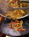 Mexican authentic food, chicken fajitas served on a hot smoking sizzling plate