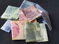 Mexican banknotes of different denominations unorganized