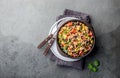 Mexican black bean corn quinoa salad in clay bowl top view, copy space