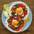 Mexican breakfast huevos rancheros: fried egg with salsa closeup in the pan Royalty Free Stock Photo