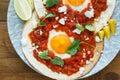 Mexican breakfast huevos rancheros: fried egg with salsa closeup in the pan Royalty Free Stock Photo