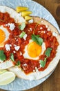 Mexican breakfast huevos rancheros: fried egg with salsa closeup in the pan Royalty Free Stock Photo