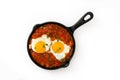 Mexican breakfast: Huevos rancheros in iron frying pan isolated Royalty Free Stock Photo